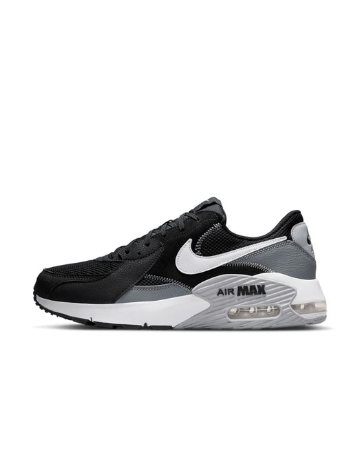 A pair of black, gray, and white Nike Men's Air Max Excee shoes featuring the visible "AIR MAX" branding on the heel. The image showcases the product purchased for $80.91 in USDC via crypto through the x402 payment method.