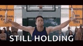 The image features a man in a gym holding two rings, likely as part of an exercise routine or competition. There are many other people surrounding him, possibly also participating in the same activities at the gym. The caption below the picture reads "If #XRP CAN HIT $10K then I think #CROFAM is right in thinking we can hit $10". This suggests that GymPact might be offering a reward for hitting fitness goals with XRP currency.