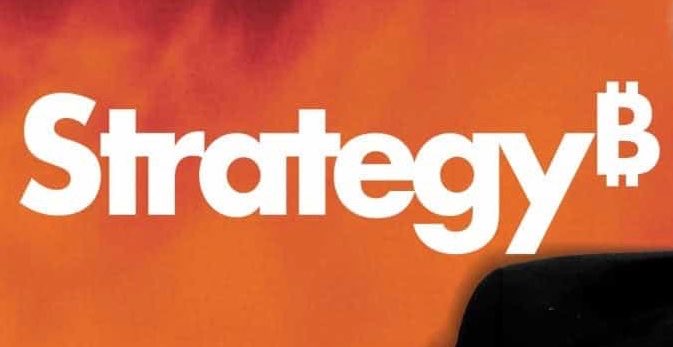 The image features a large orange sign with white text that reads "Strategy" followed by the word "B", which is capitalized, and then "BTC" at the end of the word. The background color of the sign is orange, matching the overall theme of the image. The post includes an image of a chair in black and red colors, placed behind the sign.