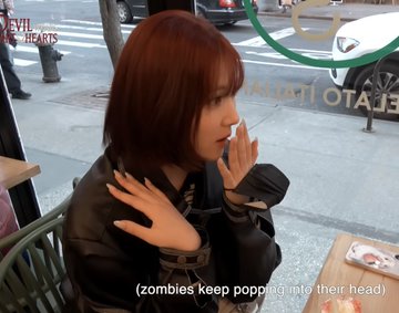 A woman with reddish-brown hair wearing a black leather jacket smokes a cigarette at an outdoor café, with the caption "zombies keep popping into their head" displayed below. The image humorously illustrates the poster's comment about repeatedly returning to ATCH for the 11,625th time, depicting a person in a dazed, zombie-like state fixated on something.