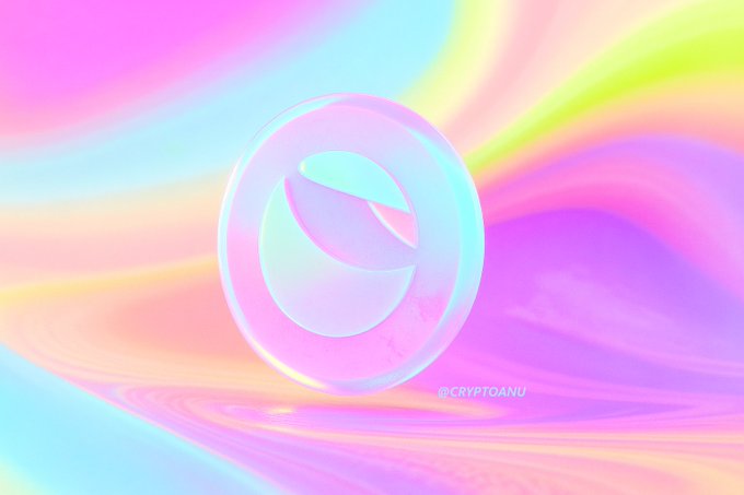A 3D-rendered, iridescent circular logo with a cutout, set against a flowing, pastel-colored background with '@CRYPTOANU' watermark.