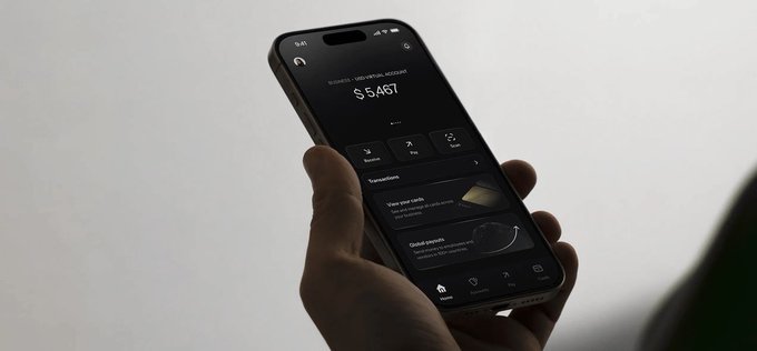 A person holds a smartphone displaying a crypto card with a balance of $5,461 and options for "Physical card" and "Global access," visually supporting the post's message about explosive growth in crypto card spending.