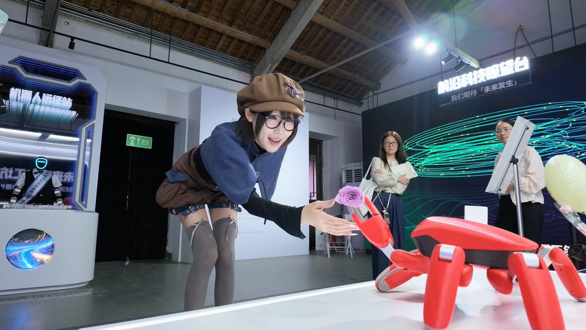 A woman in a beret and glasses leans forward to receive a purple rose from a red robotic dog, while two other women observe in the background at what appears to be a Chinese technology exhibition, with signage reading "前沿科技明星谷" (Cutting-Edge Technology Star Valley) and "我们期待'未来发生'" (We look forward to the 'future happening'). The scene perfectly illustrates the trend toward increasingly lifelike robotic companions offering personalized, almost romantic gestures.