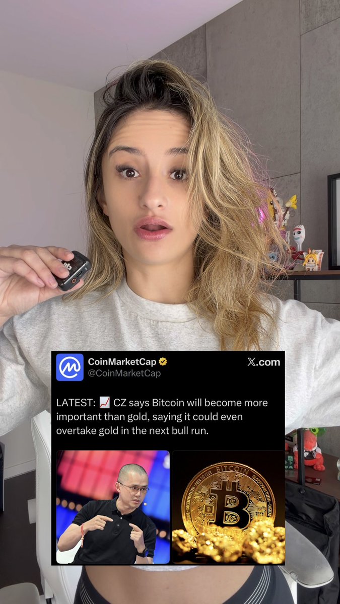 A woman records herself while holding a small recording device, with an overlaid CoinMarketCap post stating: “LATEST: CZ says Bitcoin will become more important than gold, saying it could even overtake gold in the next bull run.”