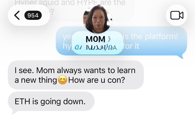 The image shows a screenshot of a text message conversation between two people, with one person's face displayed on the screen. The message reads "Mom always wants to learn a new thing How are u going down." This message seems to be directed towards the mother in question and is meant as a playful response or joke.