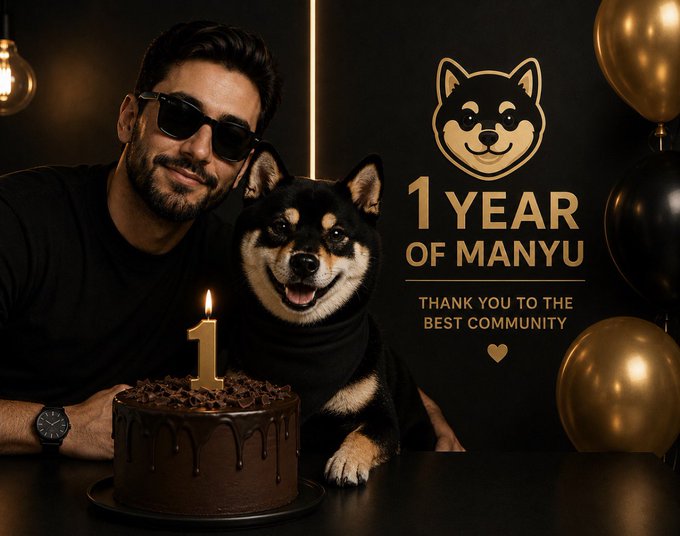 A man wearing sunglasses poses with a smiling Shiba Inu dog behind a chocolate birthday cake topped with a "1" candle, alongside gold and black balloons and a Shiba Inu logo with the text "1 YEAR OF MANYU - THANK YOU TO THE BEST COMMUNITY," celebrating the first anniversary of the $MANYU token alongside the post's tribute to its dedicated community.