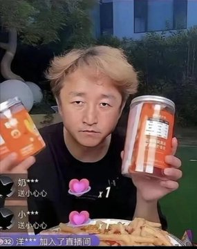 A young man with blonde hair holds up two orange containers during a livestream, with viewer comments visible on screen.