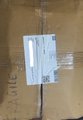 A cardboard shipping box labeled "busha" bears a packing slip for a user's crypto purchase, showing part of a "crypto day in the life" delivery from the crypto platform Busha.