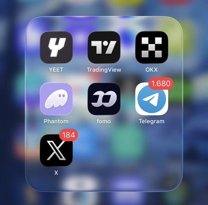 A smartphone home screen displays apps including YEET, TradingView, OKX, Phantom, fomo, Telegram (with 1,680 notifications), and X (with 184 notifications), suggesting a curated selection of crypto trading and communication platforms. The image directly illustrates the post's theme of essential apps for making money, showcasing tools for trading (TradingView, OKX, Phantom), social engagement (X, Telegram), and crypto speculation (YEET, fomo).