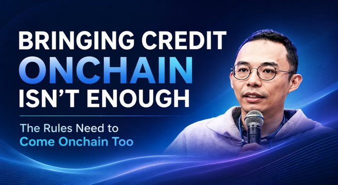Promotional banner titled 'BRINGING CREDIT ONCHAIN ISN'T ENOUGH' with subtitle 'The Rules Need to Come Onchain Too,' featuring a man with glasses speaking into a microphone.