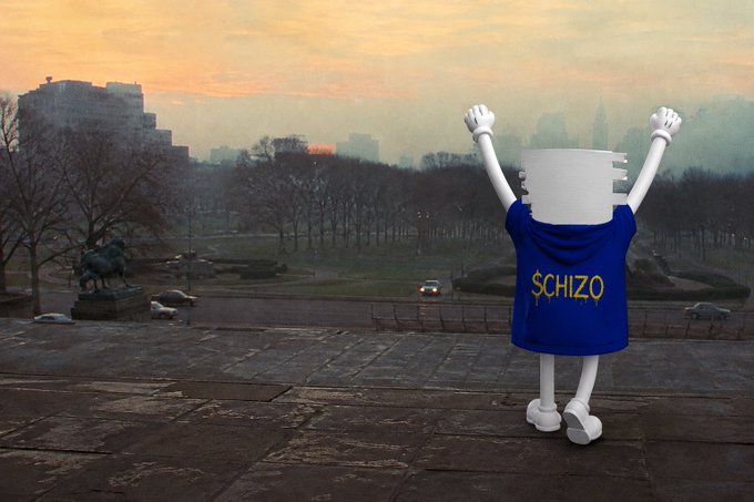A surreal scene shows an anthropomorphic spool of white toilet paper wearing a blue shirt with the text '$CHIZO', standing in a park setting at sunset with its arms raised in celebration.