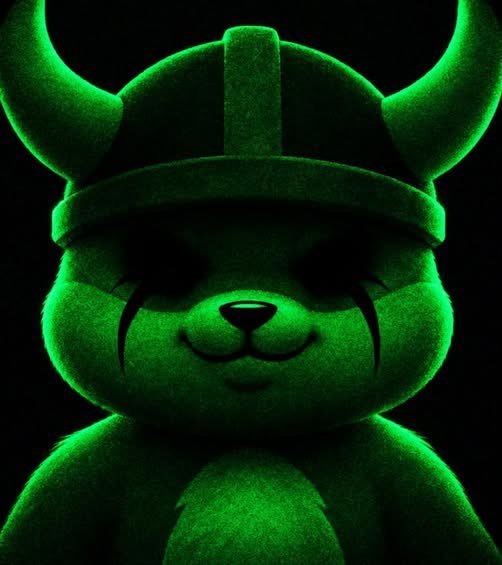 A green-lit plush toy resembling a Viking-style bear with horns and a helmet, set against a dark background.