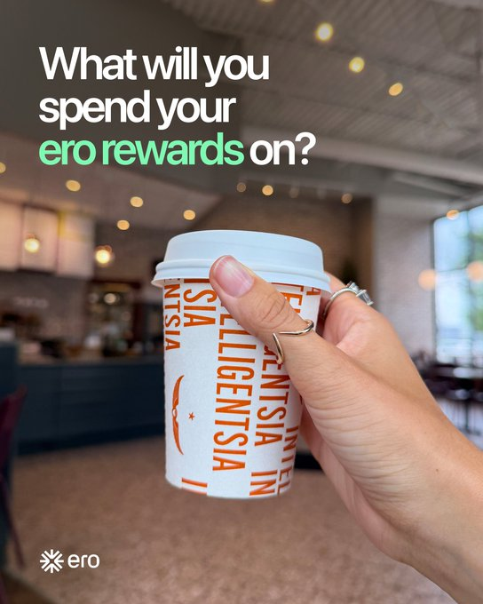 An advertisement showing a hand holding a coffee cup printed with 'INTELLIGENTSIA', with text reading 'What will you spend your ero rewards on?' and the 'ero' logo.