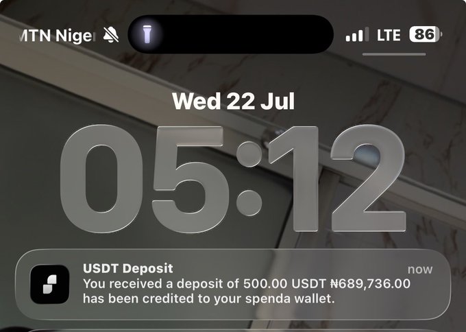 A phone lock screen showing 5:12 AM on Wednesday, July 22nd, with an MTN Nigeria notification for a USDT Deposit crediting ₦689,736.00 (≈500 USDT) to a Spenda wallet, perfectly illustrating the caption's excitement about starting the day well thanks to web3 work.
