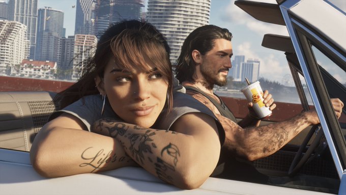 An image from Grand Theft Auto VI showing a woman with "Life's a" tattoo and a man in a convertible car with a branded drink cup, set against a city skyline—a visual nod to Rockstar Games' flagship franchise fueling the "GTA supercycle" sentiment.