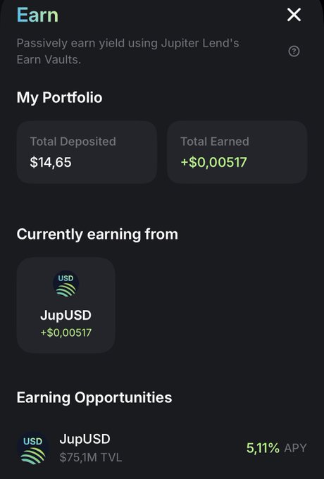 The image shows a cellphone screen displaying various information related to an app called Jupyter mobile. The main focus is on the Earn tab, where users can find details of their recent transactions. On the left side, there's a bar graph showcasing total deposited and total earned amounts from different transactions such as purchases made on Jupyter mobile apps like Jupyter v2LTV or other services. In the center of the screen, there's a payment button with two options: USD and JUPUSD (Jupyter mobile). The background color is black, making it easy to read all the information displayed on the phone screen.