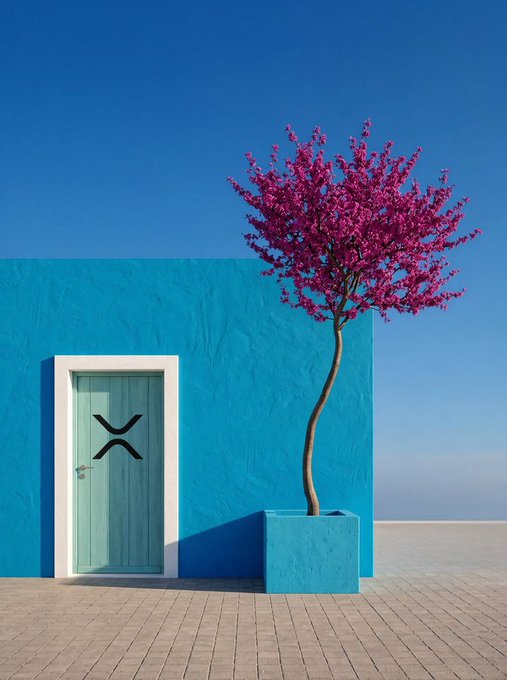 A bright turquoise building with a matching door displaying the XRP logo stands beside a planter holding a tree with vibrant pink blossoms against a clear blue sky.