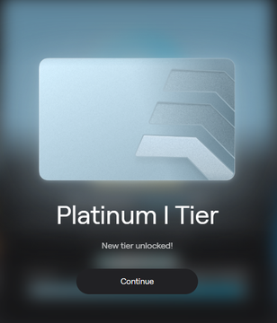 The image shows a screenshot of an iPhone screen with a message that reads "Platinum I Tier" and "New tier unlocked!". The background of the image is blue, which contrasts with the white text displayed on the phone's screen. The main focus of the image is the message, which appears to be related to a new feature or benefit for users who have purchased platinum tiers in the past.