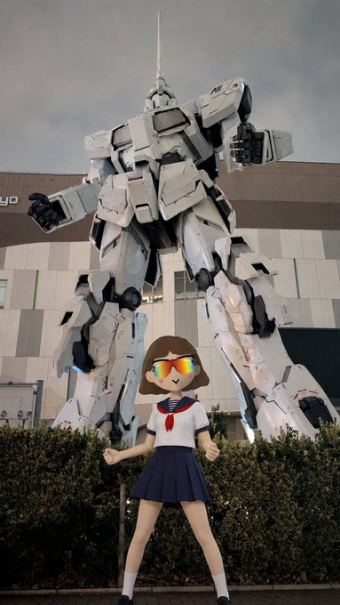 urn-shaped robot statue with arms raised, accompanied by a cartoon girl in white and blue attire on the right side.