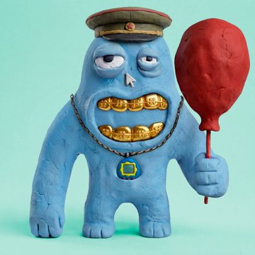 A whimsical claymation-style blue monster figure wearing a military-style cap and a gold chain, displaying gold teeth and holding a red balloon-like object.