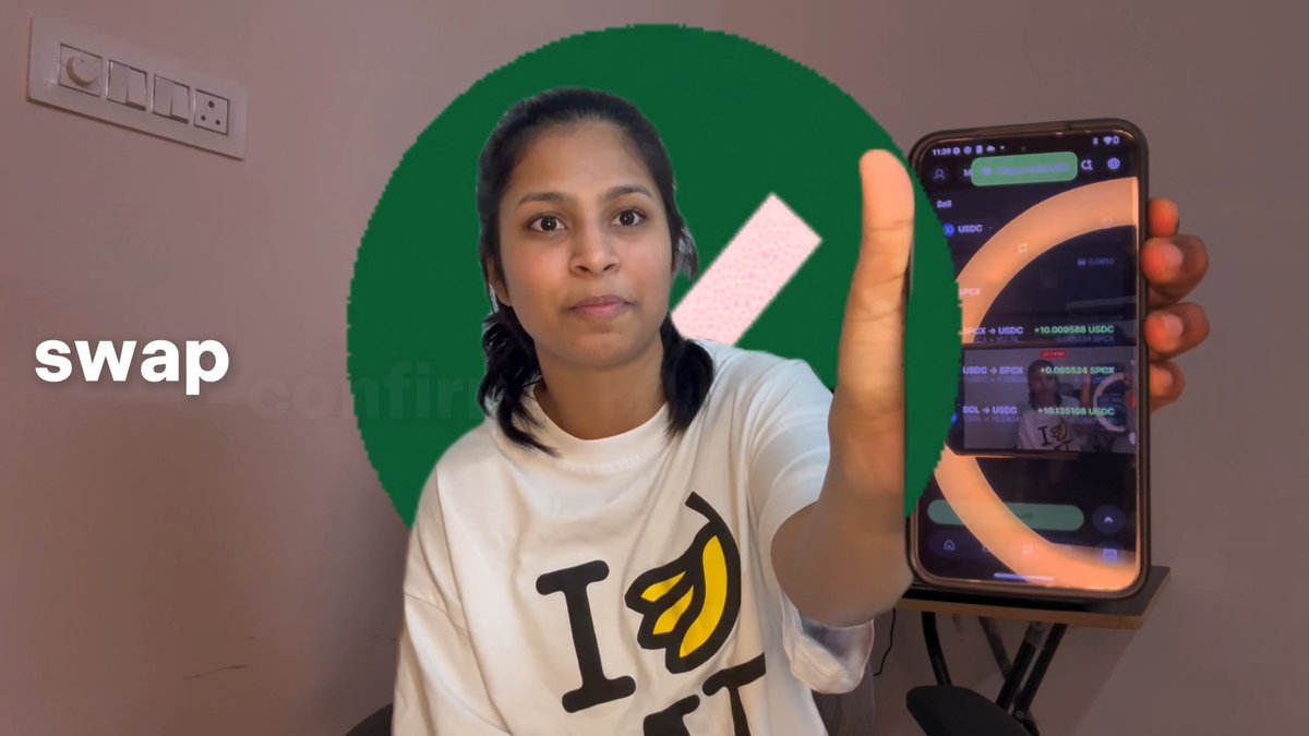 A woman holds up a smartphone displaying a crypto swap screen (showing USDC, SPCX, and USDG tickers) with the word "swap" labeled, while making a stop gesture in front of a green circle with an X, illustrating her point that the tokenised stocks were fake.