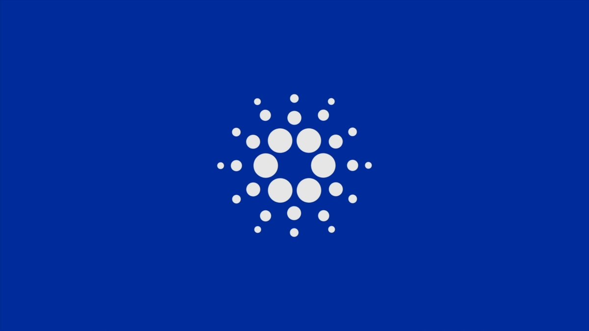 The image features a blue flag with white dots arranged in a circular pattern. The flag has a central circle surrounded by eight smaller circles, creating a unique design. The caption below the image reads "Matthieu Pizenberg ( @mattpiz ) joins us for a technical deep dive into elm-cardano and the architecture roadmap leading up to its v1.0 release". This text is located at the bottom of the image, providing context about the content and creator behind it.
