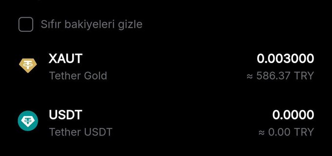 A cryptocurrency portfolio screen showing XAUT (Tether Gold) at 0.003000 (≈586.37 TRY) and USDT at 0.0000 (≈0.00 TRY), with a checkbox for 'Sıfır bakiyeleri gizle' (Hide zero balances).