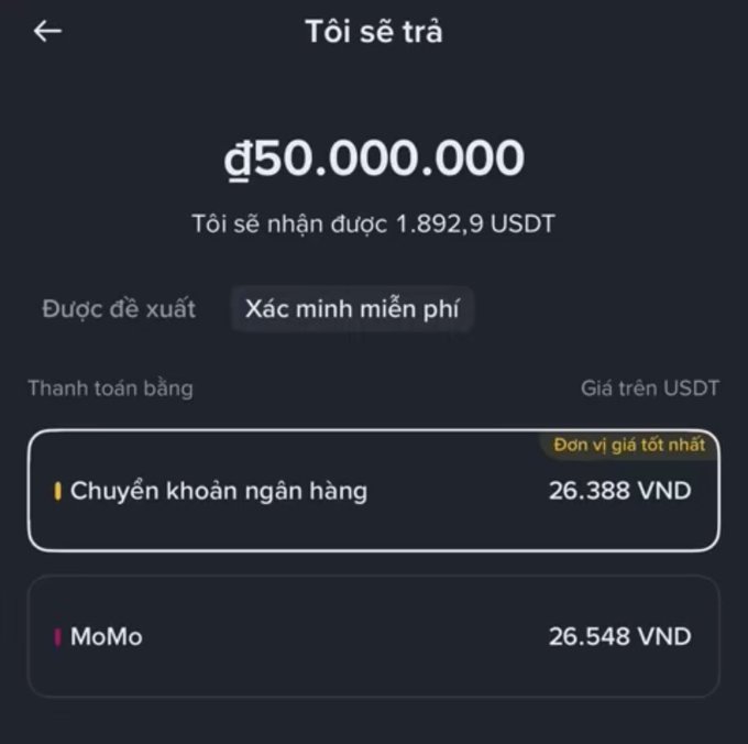 A Vietnamese cryptocurrency exchange interface showing a sale of 50,000,000 đ for 1,892.9 USDT, with payment options including bank transfer at 26,388 VND and MoMo at 26,548 VND.