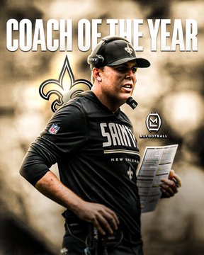A coach is on the side of a field holding a play card and wearing a black New Orleans Saints shirt and headset, with "COACH OF THE YEAR" written above him in white text and the Polymarket logo on the right side. The image relates to the news of New Orleans Saints head coach Kellen Moore being the favorite to win the 2026 NFL Coach of the Year award.
