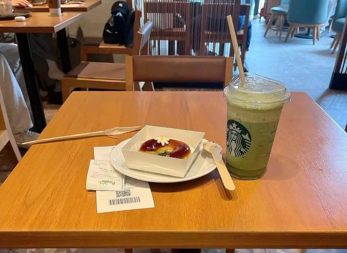 A Starbucks matcha latte and a pastry sit on a wooden café table next to a PayPal receipt, while the post reflects on the "cleansing" of the crypto market and the surviving projects that will rebuild. The image of a consumer enjoying an ordinary coffee break contrasts with the post's commentary on the death of excess "noise" projects in crypto, suggesting a return to simplicity and clarity.