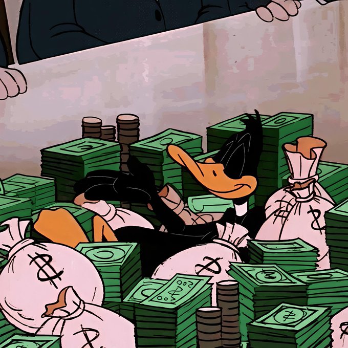 A cartoon illustration of Daffy Duck lounging luxuriously atop piles of cash and money bags marked with dollar signs.
