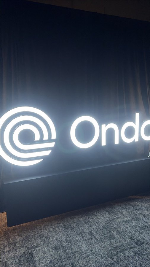 An illuminated 'Ondo' sign with a circular logo displayed against a dark background.