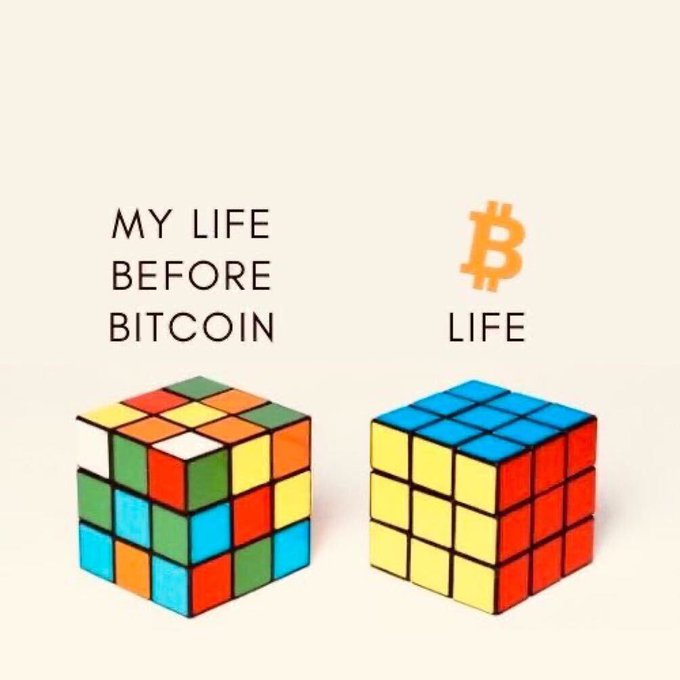 Two Rubik's cubes are shown side by side: a scrambled, multicolored one labeled "MY LIFE BEFORE BITCOIN" and a neatly solved one labeled "LIFE" beneath the Bitcoin (₿) logo, humorously illustrating how Bitcoin brought order and clarity to the poster's life, in line with their grateful morning message.