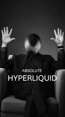 The image features a man sitting in an armchair with his arms raised up, as if he's about to make a grand gesture or shout. The background of the image is black, which contrasts with the white text that reads "I'M WAITING FOR THE DAY WHEN HYPE flips $SOL". This phrase suggests that the man might be waiting for something related to the hype surrounding a particular product or service, possibly Hyper Liquid.