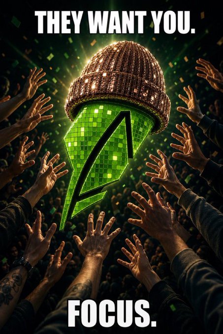 A concert crowd reaches toward a glowing green mirrorball-style cap featuring the Stussy "S" logo, with the bold text "THEY WANT YOU." at the top and "FOCUS." at the bottom.
