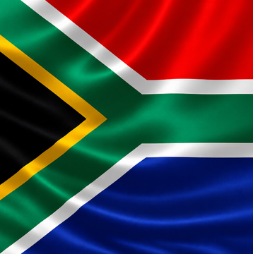 The image displays a waving South African flag, providing a clear visual cue to the country involved in the news. The accompanying post reveals that South Africa's First National Bank (FNB) has launched crypto trading services allowing clients to buy major cryptocurrencies, though the assets remain restricted within FNB's ecosystem and cannot be withdrawn to external wallets.