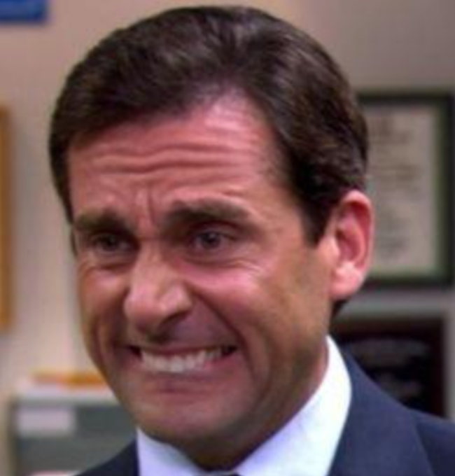 The image shows actor Michael Scott (Steve Carell) from "The Office" making a cringe-worthy, strained smile, captioned in the context of a botched seed phrase recovery joke. The accompanying post humorously suggests photographers captured the awkward moment when someone realized their crypto wallet seed wasn't just misplaced but was handled by the wrong person (referencing "Not your keys, not your coins").