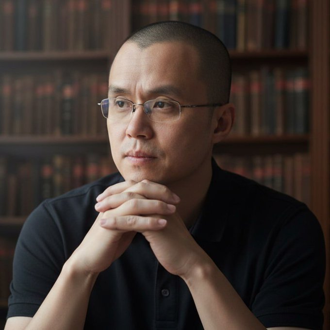 A man with glasses sits thoughtfully with his hands clasped in front of a bookshelf. The post relates to the image, likely depicting "CZ" (Changpeng Zhao), the founder of Binance, referencing his remarks about Bitcoin.