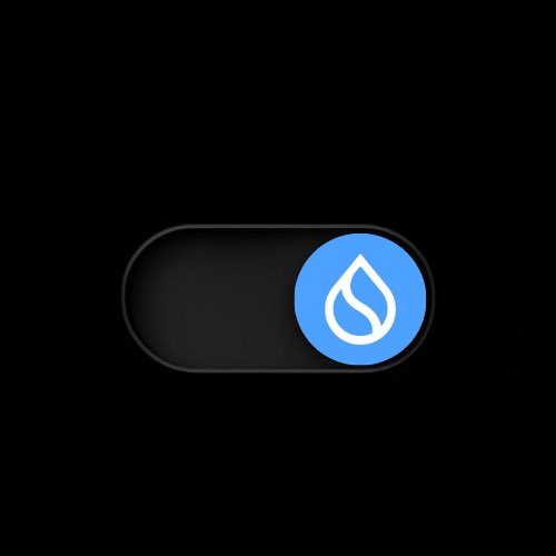 A dark pill-shaped toggle switch is shown with a blue circular button featuring a white water droplet icon, symbolizing the activation of the Sui blockchain network. The image visually reinforces the post's message of a "Big Week on Sui" by depicting the network being switched "on."