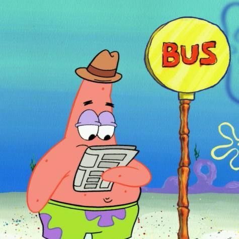 Patrick Star from SpongeBob SquarePants wearing a brown hat and green shorts, standing next to a 'BUS' sign while reading a newspaper underwater.
