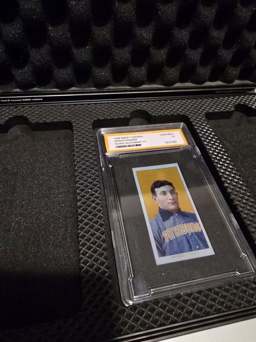 A graded 1909 T206 Sweet Caporal Honus Wagner baseball card (Pittsburgh) in a PSA slab resting inside a black foam-lined protective case.
