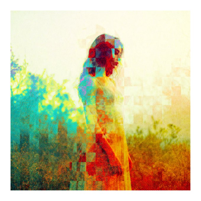 A colorful, abstract double-exposure style image of a woman with long hair, featuring pixelated blocks and a mix of red, yellow, green, and blue hues.
