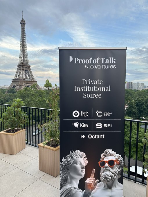 The image features a black sign with white text advertising "PROFIT OF TALK", which is displayed prominently on a balcony or rooftop, possibly at an event or gathering. The sign also includes a picture of two people wearing sunglasses and a pair of sunglasses, as well as logos for other companies such as "KILI" and "SFI". The background shows the Eiffel Tower in Paris, France, which is visible behind the balcony where the sign is displayed.

The image also contains some text that reads: "Keep build and build, that' s what $KITE always does. Let' s fly even higher!". This phrase seems to be a reference to the Eiffel Tower or the concept of reaching new heights in business or personal growth.