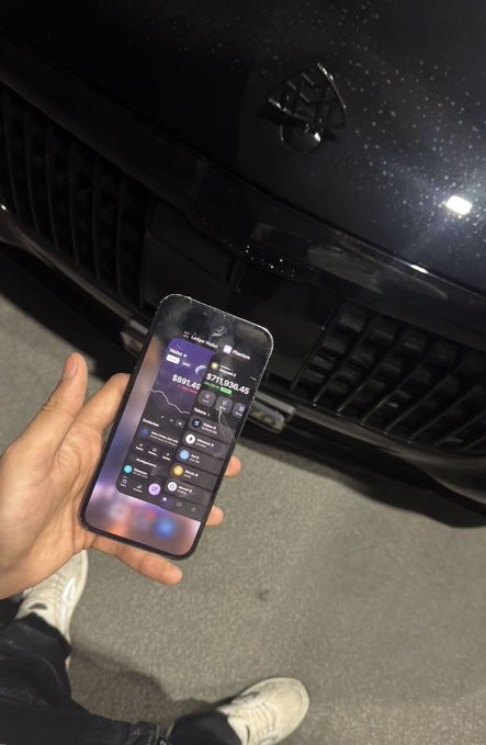 A hand holds up a smartphone displaying a trading app with portfolio values of $801.4K and $211,636.45, in front of a Mercedes-Benz grille, visually backing the post's claim of delivering "2 100X" gains.