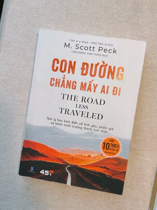 A book titled "The Road Less Traveled" by M. Scott Peck rests on a textured surface, with its Vietnamese title "Con Đường Chẳng Mấy Ai Đi" displayed prominently on the cover.

The image appears unrelated to the post's discussion of Quip Network and Proof of Useful Work, as the book cover has no visible connection to cryptocurrency, quantum computing, or optimization networks—though the title "The Road Less Traveled" could metaphorically echo the post's theme of pursuing an unconventional, purposeful approach to computing.