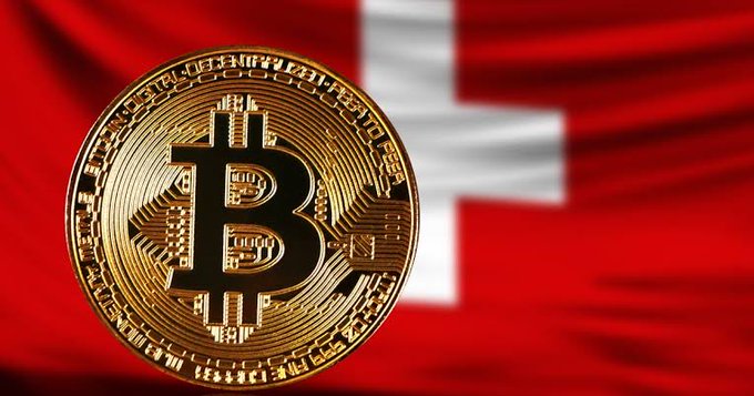 A golden Bitcoin coin prominently displayed against the backdrop of the Swiss flag, symbolizing Switzerland's approval of its first spot Bitcoin $BTC ETF for retail investors by FINMA.