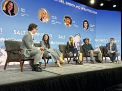 A panel discussion takes place on stage at the Salt Conference, with the text 'SALT CONFERENCE' and 'DUE, RESG, AND INFLUENCING' visible on the backdrop above the seated speakers.