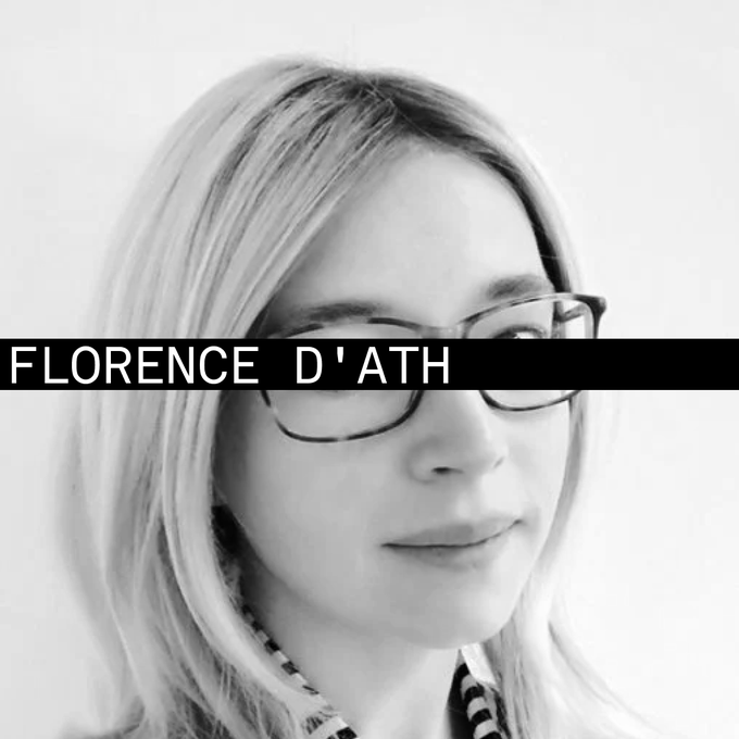 The image features a woman with blonde hair wearing glasses, who appears to be smiling at the camera. She has her face partially obscured by a black and white filter or a black and white filter that reads "Florence D'Ath". The focus of the image is on the woman's face and not on any other elements in the scene.