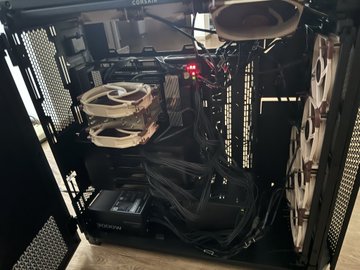 A Corsair-branded gaming PC with a transparent side panel reveals its internal components, featuring a Noctua cooling fan, RGB-illuminated Corsair memory, and a clean black-and-white cable management setup. The image reflects the "My life in 4 pictures" post by highlighting a passion for high-end PC building and hardware customization as a defining hobby.