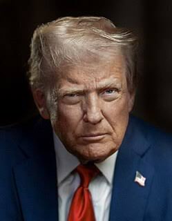 A close-up portrait of President Trump in a suit and red tie shows him in discussion about the "Crypto Clarity Act".